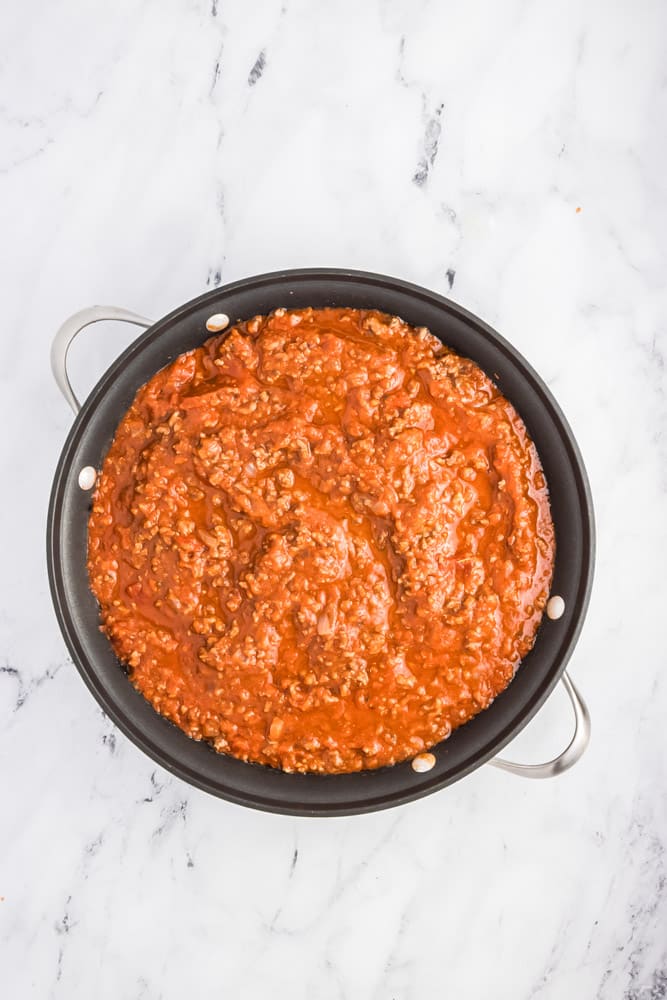 tomato meat sauce in a round cast iron pan