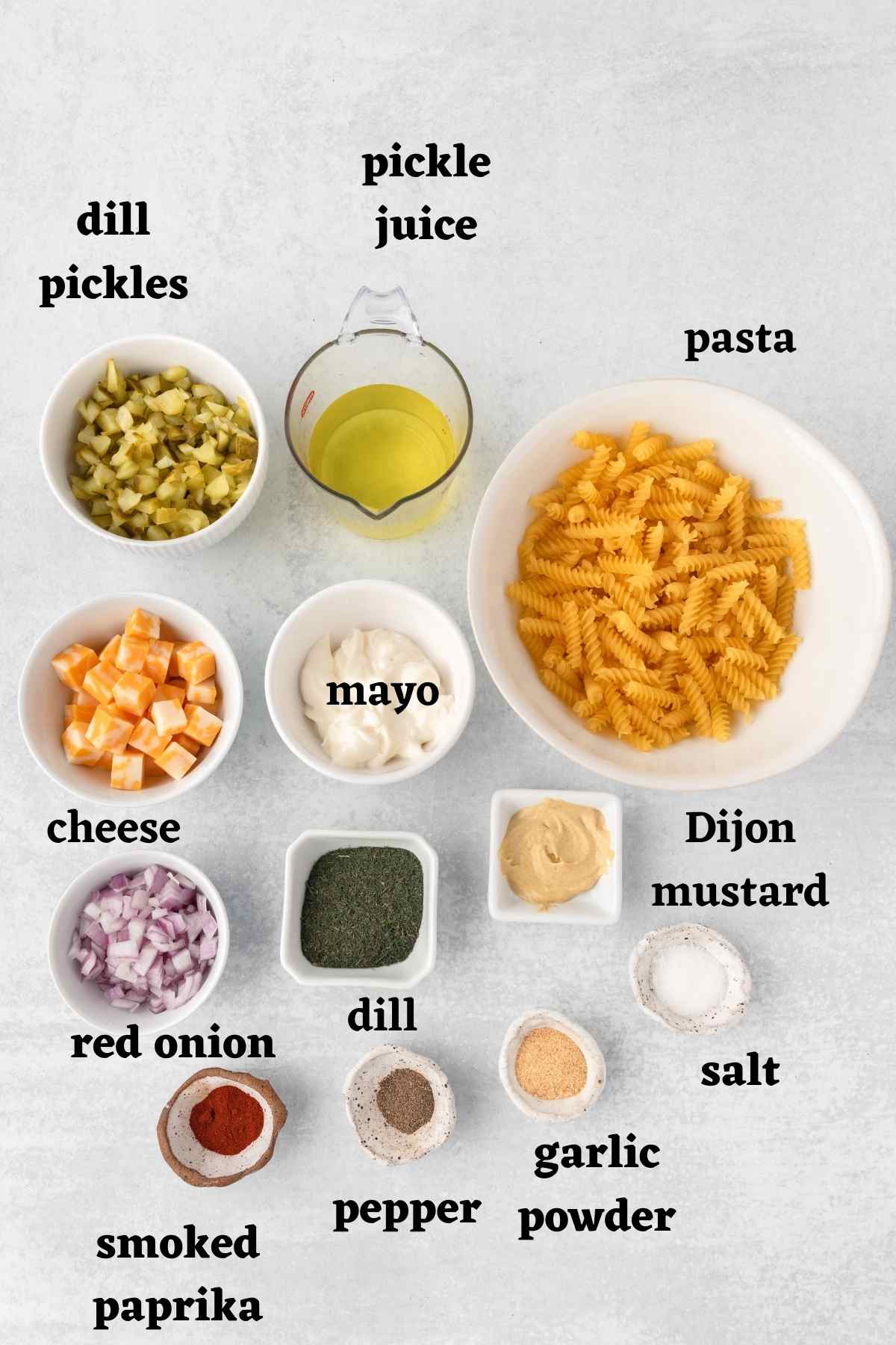 Ingredients needed to make dill pickle pasta salad.