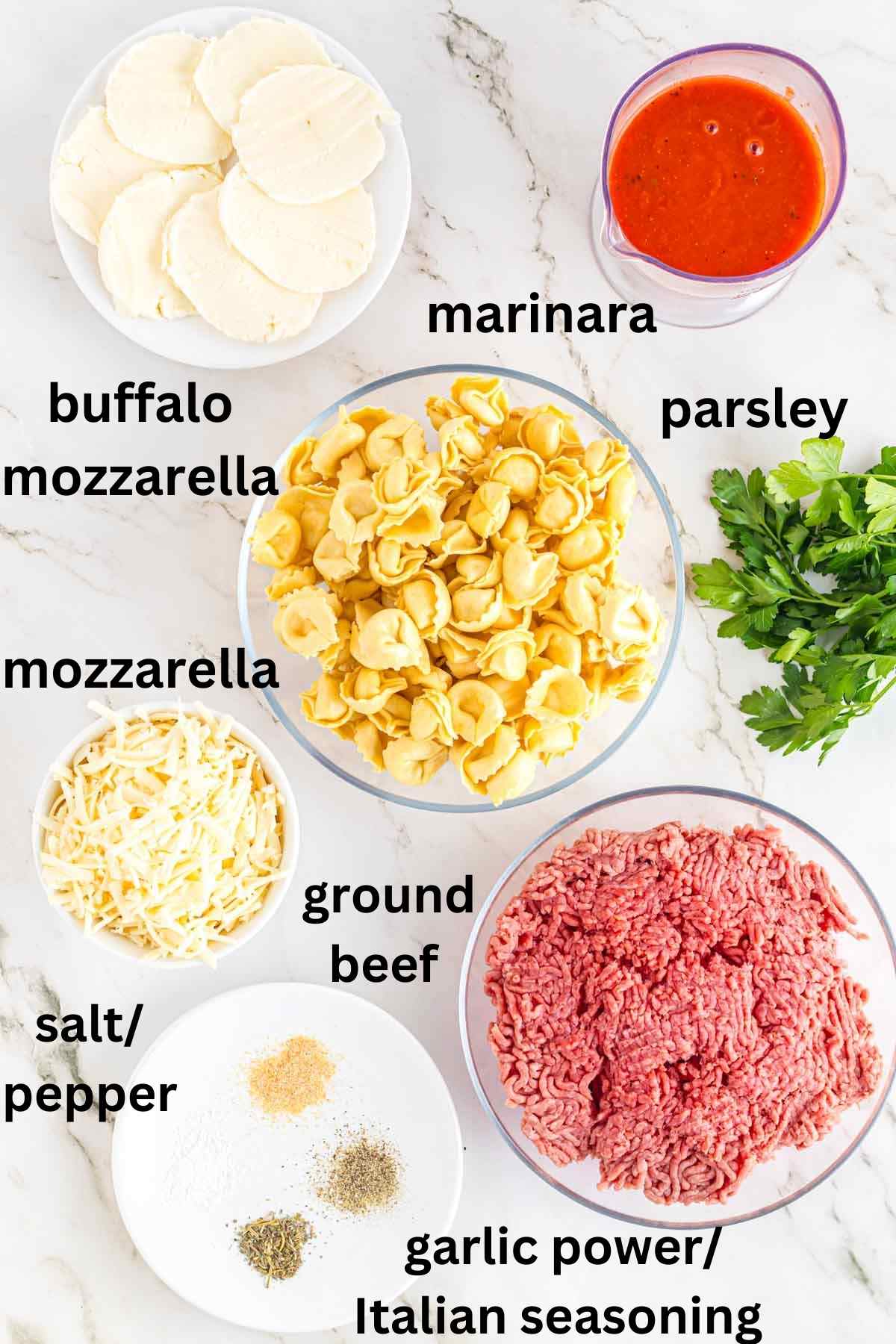 Ingredients needed to make cheesy baked tortellini casserole.