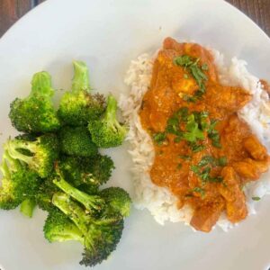 Trader Joe's Tikka Masala Curry Sauce on top of rice with broccoli.