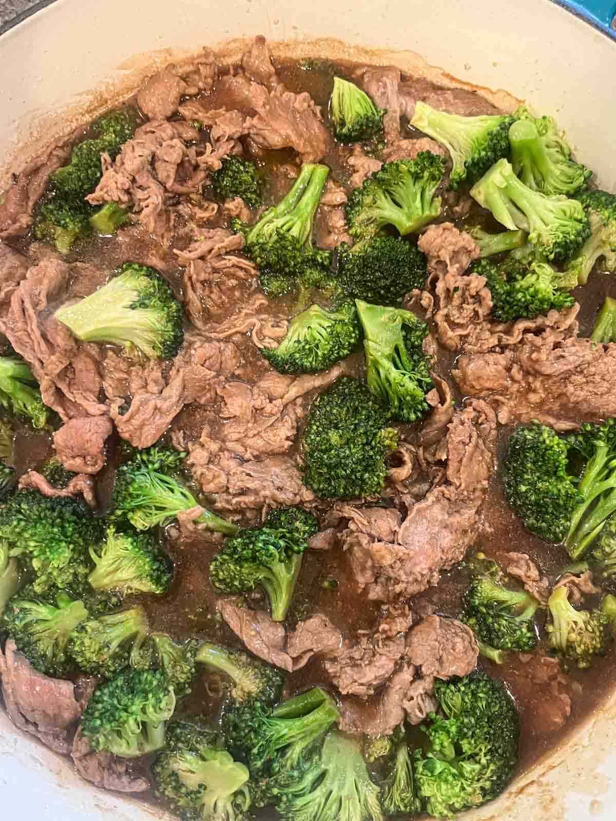 Trader Joe's shaved steak and broccoli in a pan.