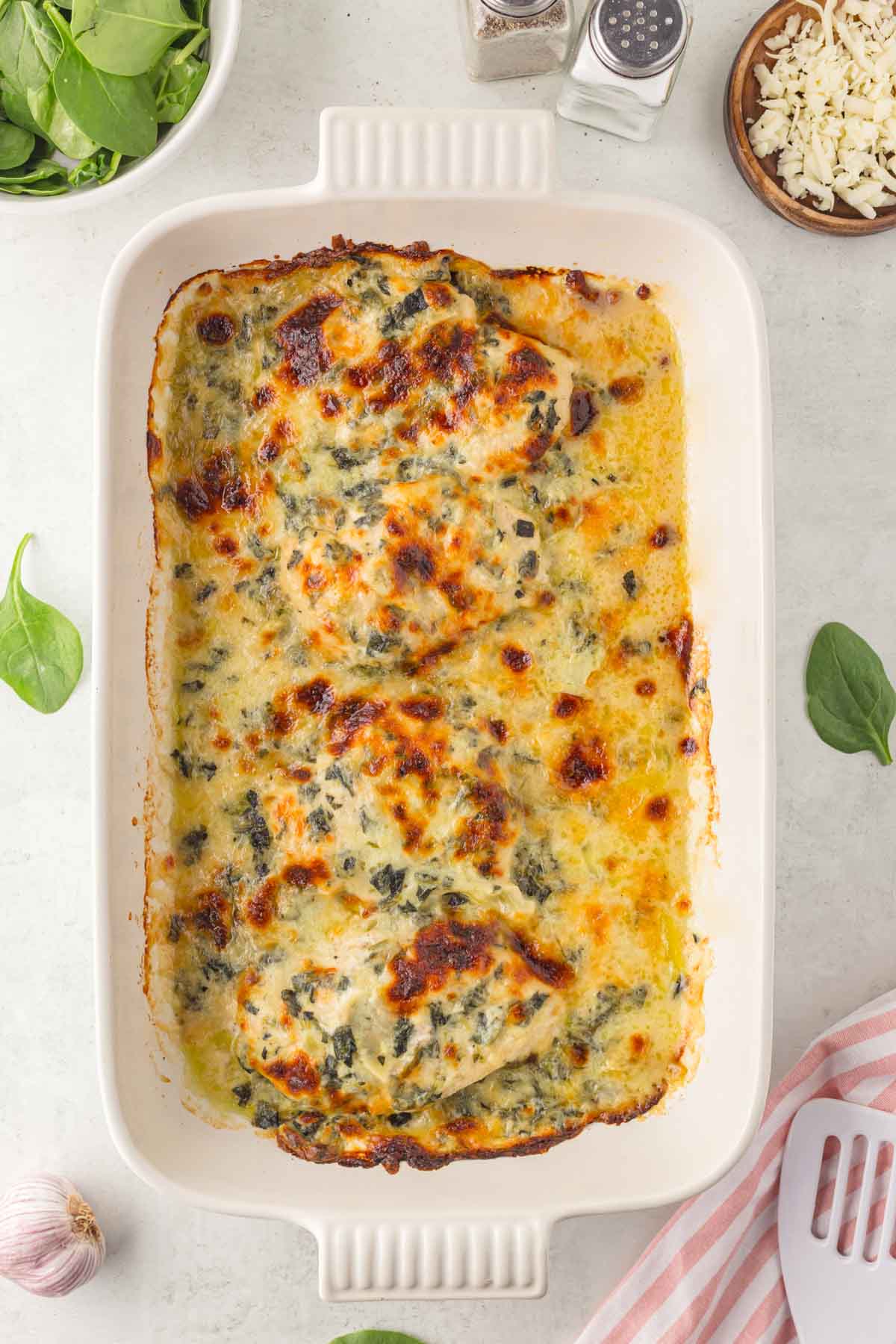 Trader Joe's spinach and artichoke chicken in the baking dish.