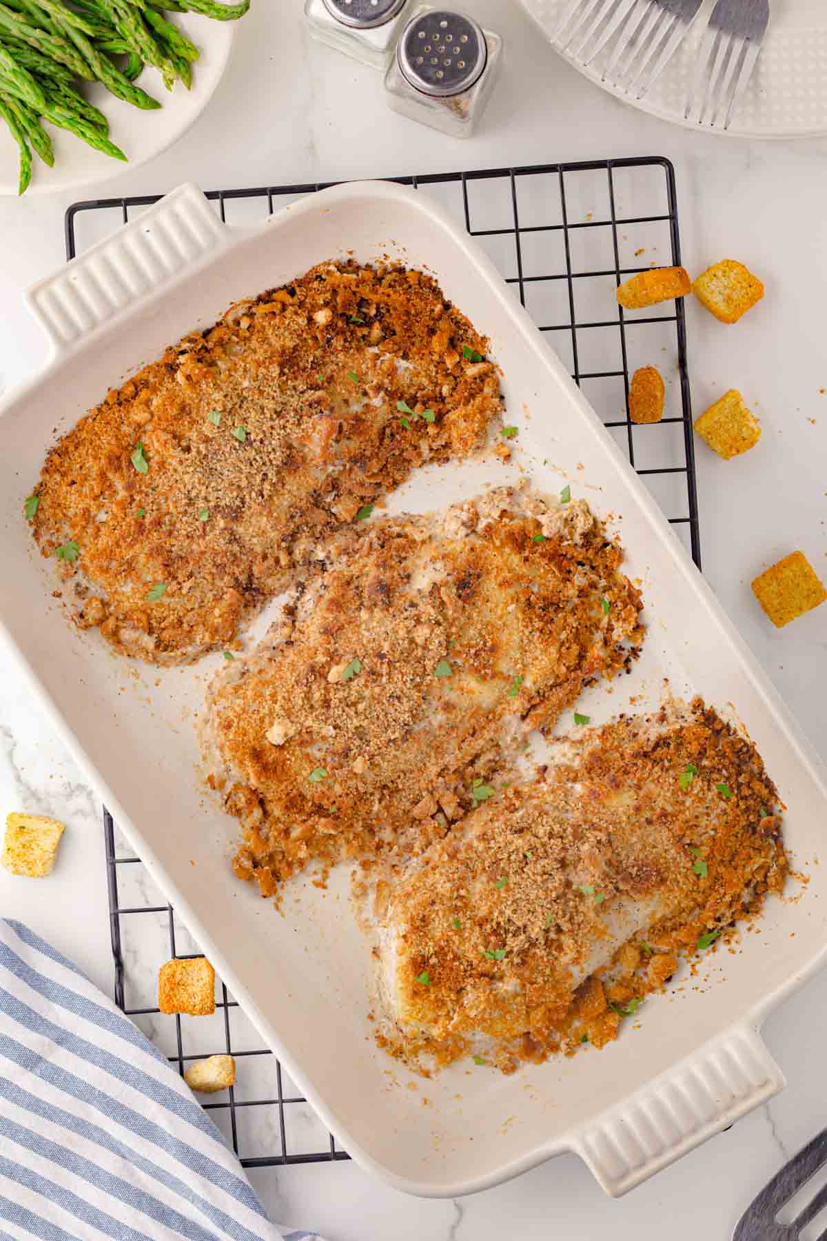 Caesar chicken bake finished dish in a white casserole.