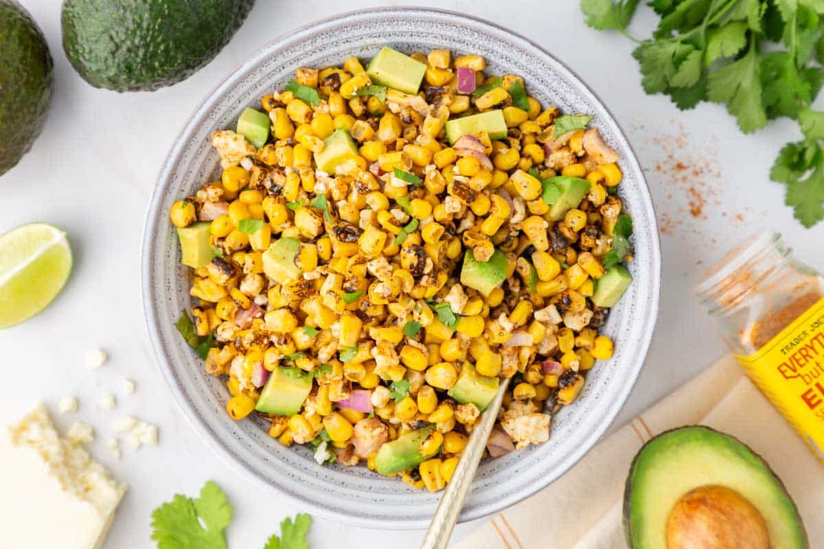 Trader Joe's elote corn salad in a large serving bowl.
