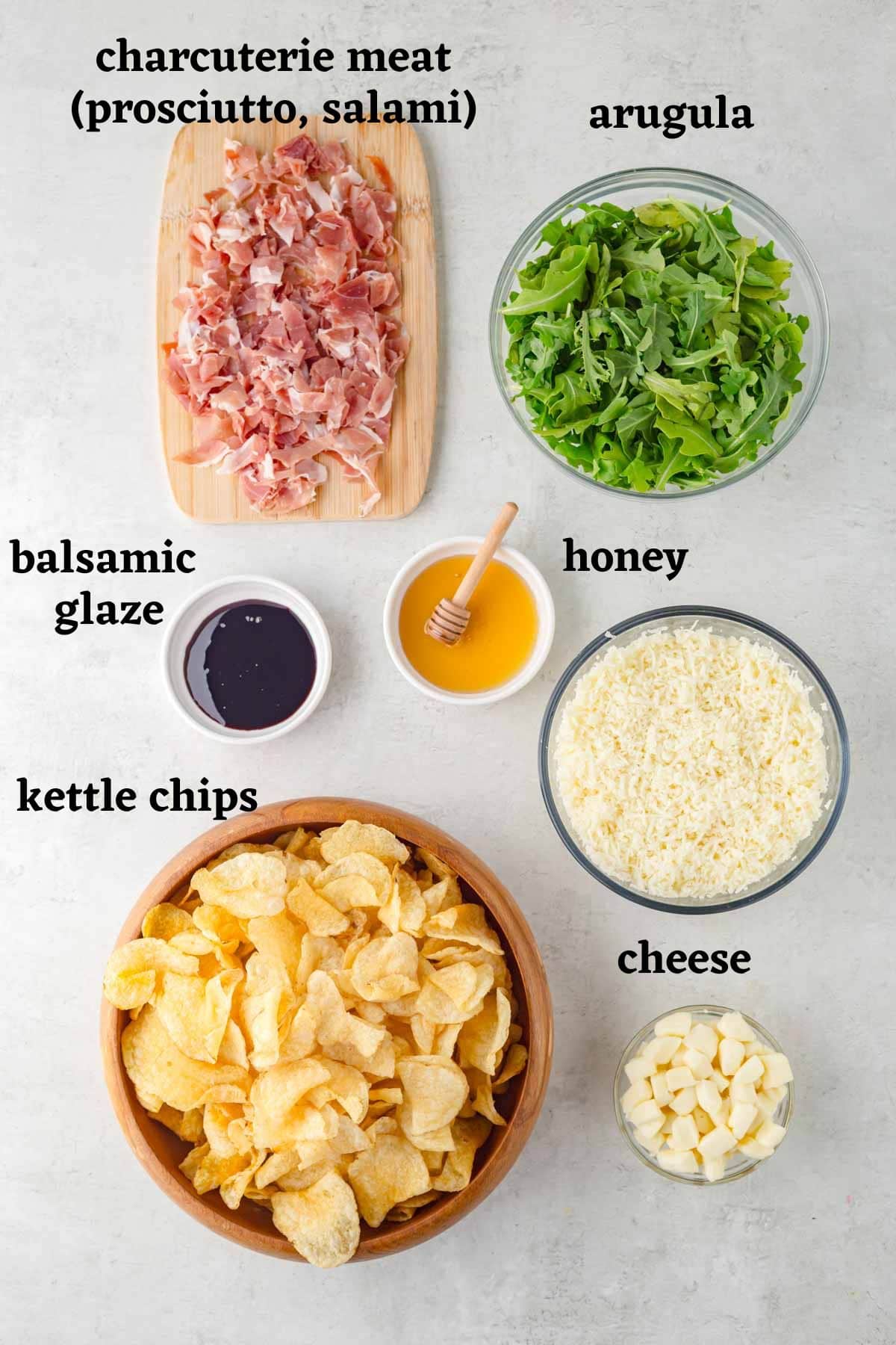Ingredients needed to make charcuterie nachos.